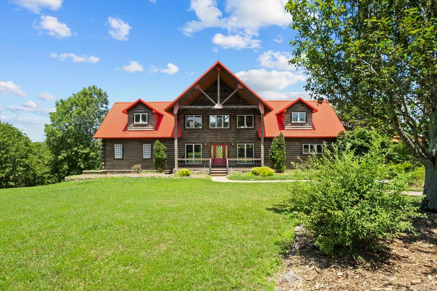 Discover unparalleled beauty and breathtaking views on your own, private 60-acre oasis! This prestigious estate features a custom oak log home with a wrap-around porch, offering panoramic vistas from its wood-lined walls. Primary Suite on the main level. Upstairs, two guest suites connect to a living/bonus area, complemented by two additional bedrooms and a lower level with a walk-out patio. Calling all who wish to homestead/ live away from the world or those looking for a corporate retreat center!  Driveway is 0.9 of a mile long. Highlight of the property is the 60 x 80 barndominium, built in 2010, with a 3BR/ 2BA full living quarters. Unique touches include a cedar-lined ceiling, surround sound, and a custom kitchen with high-profile stainless steel appliances. A workshop area with multi-work stations and indoor RV parking add versatility, while stairs lead to three expansive bedrooms or multipurpose rooms and a full bath. Both dwellings are equipped with zoned heating and air conditioning and their own generators. Perfect for a family retreat or potential wedding venue, this property offers endless possibilities.  Agents see Rmks- Sq ft approx, pls measure.