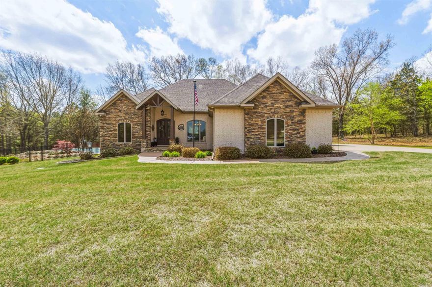 Located outside the city limits in Bridge Field subdivision, this home sits on 5 acres in a cul-de-sac and offers plenty of space inside and out. There are 4 bedrooms and 2.5 bathrooms with an open floor plan and split bedroom layout. The two guest bedrooms are located on one side of the house. The kitchen includes granite countertops, stainless steel appliances, gas cook top, coffee bar, and a large island. There is also a formal dining area. The primary bedroom is spacious and has an adjoining room that would make a great office or nursery. The primary bathroom features double vanities, soaker tub, separate shower, and connects to a large walk-in closet that leads into the laundry room for added convenience. The 4th bedroom could also be used as a bonus room. There is also a walk-up staircase to the attic for easy access and storage. Outside you will find a covered back porch, flagstone patio, storage building, lean-to, RV 220 hookup, and an in-ground pool. HW '21, shed '21, Heat Pump '21 & '22, Pool filter '22, gutters '23, dishwasher '23, paint '24, pool pump '24, salt system '25, garage door & opener '25, fence '25, water regulator '23, front door '23 and more.