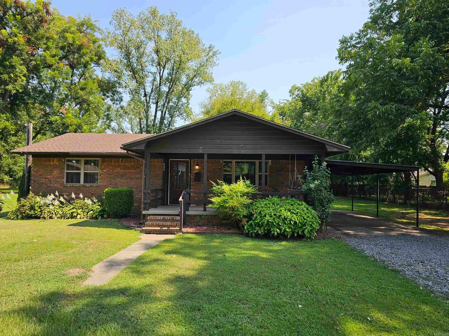 Move-in ready 2/1 brick home in Dardanelle. Large shade trees and pretty flower beds. The roof, windows, and HVAC are less that 5 years old. It has an attached carport as well as a detached garage out back. With over a 1/4 acre lot, there is plenty of room for outdoor activities. The bedrooms are good size and so is the livi