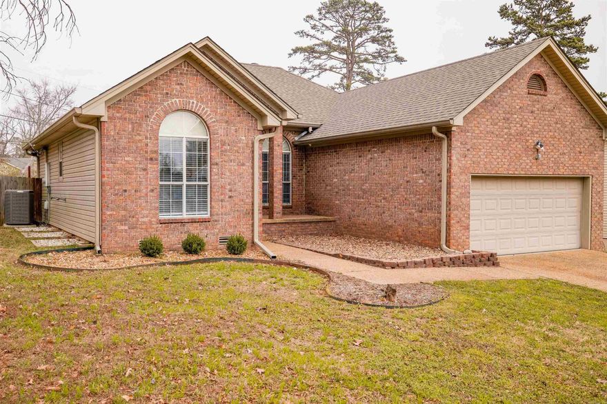 Brick and vinyl exterior. Split floor plan. New Quartz counter tops, new sinks and faucets in bathrooms and kitchen. Bathroom countertops have been raised to new height . New tile shower in hall bath. New gas range, new refrigerator, new dishwasher.  Roof was put on 2020. HVAC 2011. Living and kitchen have an Open floor plan with wood floors and vaulted ceilings. There are alot of big windows. Great deck 29'x14'. French doors from main BR to the deck. Huge walk-in closet in the main bedroom. Fenced backyard. Crawl space with great storage. House is wired for a generator and speakers outside.
