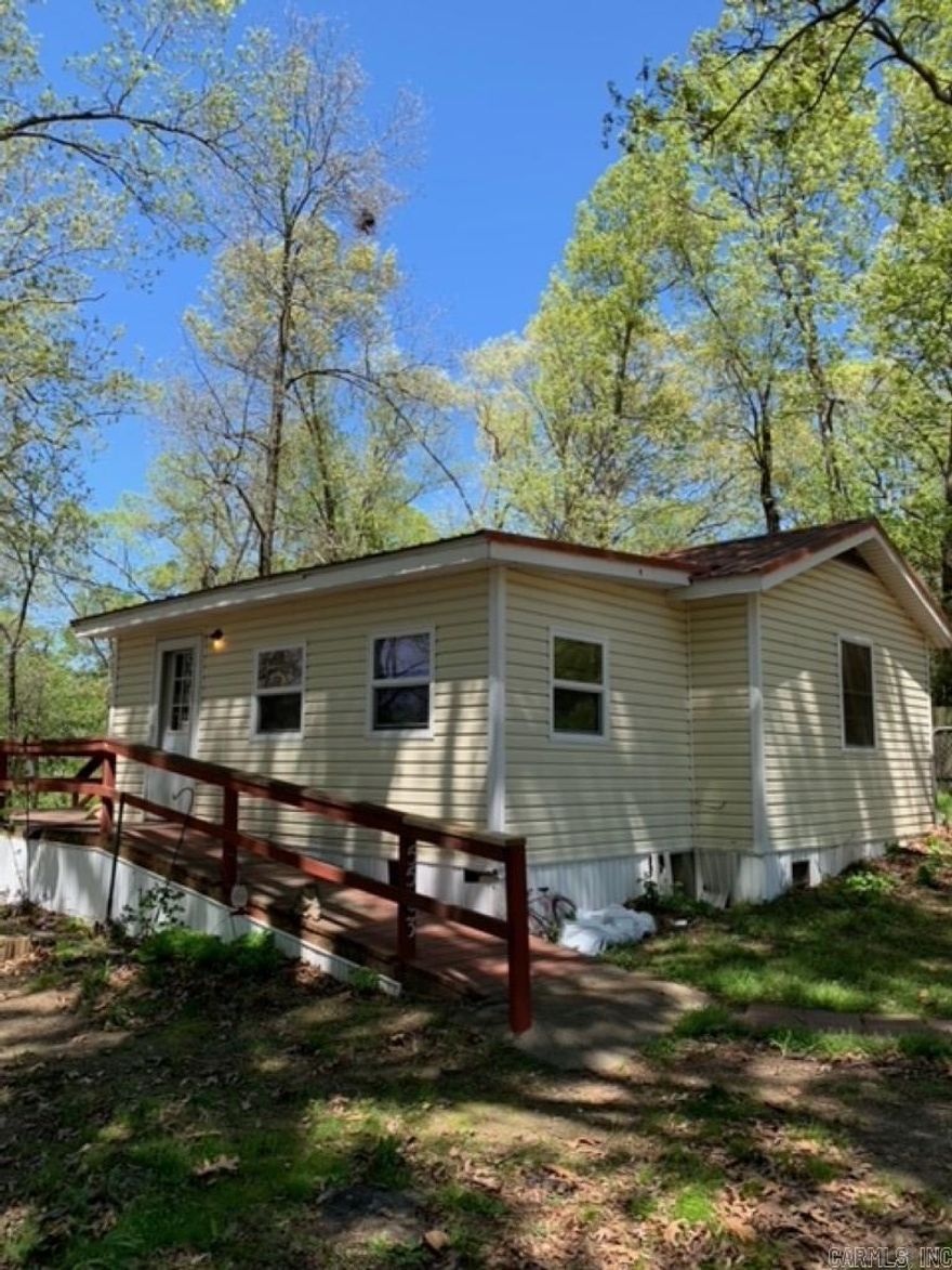 Charming one room lake house nestled on .5 acres of picturesque land, offering a tranquil retreat on the shores of Lake Poinsett in beautiful Poinsett County. This cozy getaway awaits your personal touch and TLC, providing an excellent opportunity for renovation and customization to suit your preferences. Features include a serene waterfront setting, perfect for fishing, boating, and relaxing. Additionally, the property boasts an old dock ready for renovation, allowing for endless possibilities to create your dream lakeside escape. Don't miss out on the rare chance to own a slice of lakeside paradise with unlimited potential. To be sold as-is.