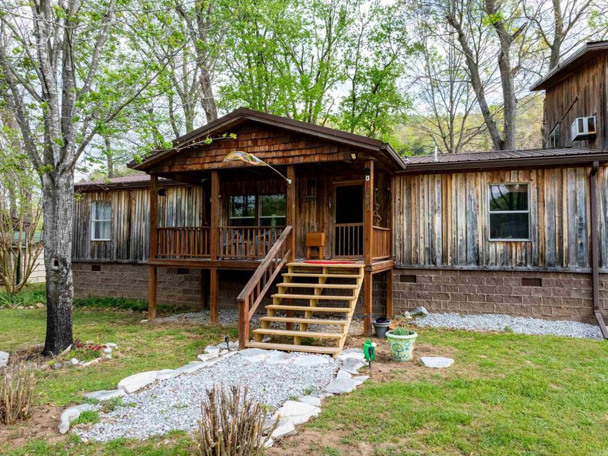 Welcome to this incredible 2.24 +/-  acre riverfront property on the White River, offering breathtaking views and direct access to one of Arkansas’ most sought-after waterways. Positioned along the banks of the river, this home was purchased new by the seller and placed on the property, now sitting on a permanent foundation. Elevated for added peace of mind, the home features a large custom addition with 28 feet of windows, perfectly designed to capture the stunning river views. Inside, you’ll find 3 bedrooms and 2 bathrooms, along with a spacious loft in the addition, providing extra room for relaxing or entertaining. The home also includes a sunroom, bonus room, craft room, and workshop, offering versatility for full-time living or a weekend retreat. Step outside and enjoy your own private access point to launch a boat or kayak, making it easy to take full advantage of everything the White River has to offer—from fishing to floating.Whether you’re looking for a full-time residence, riverfront getaway, or vacation rental investment, this property offers incredible potential in a beautiful setting. Equal Housing Opportunity.