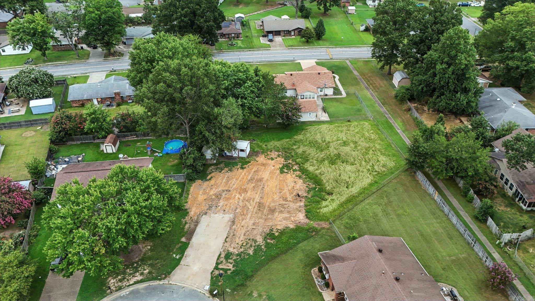 Come build your dream home in the established Stonewall subdivision! This cleared lot at 109 Essex Cove is ready for a fresh start after a house fire led to a full demolition, including the footings. All utilities—water, sewer, gas, and electric—are available on site, saving you time and money when you’re ready to build. Located in a quiet cul-de-sac in with mature trees, wide streets, and a strong sense of community.