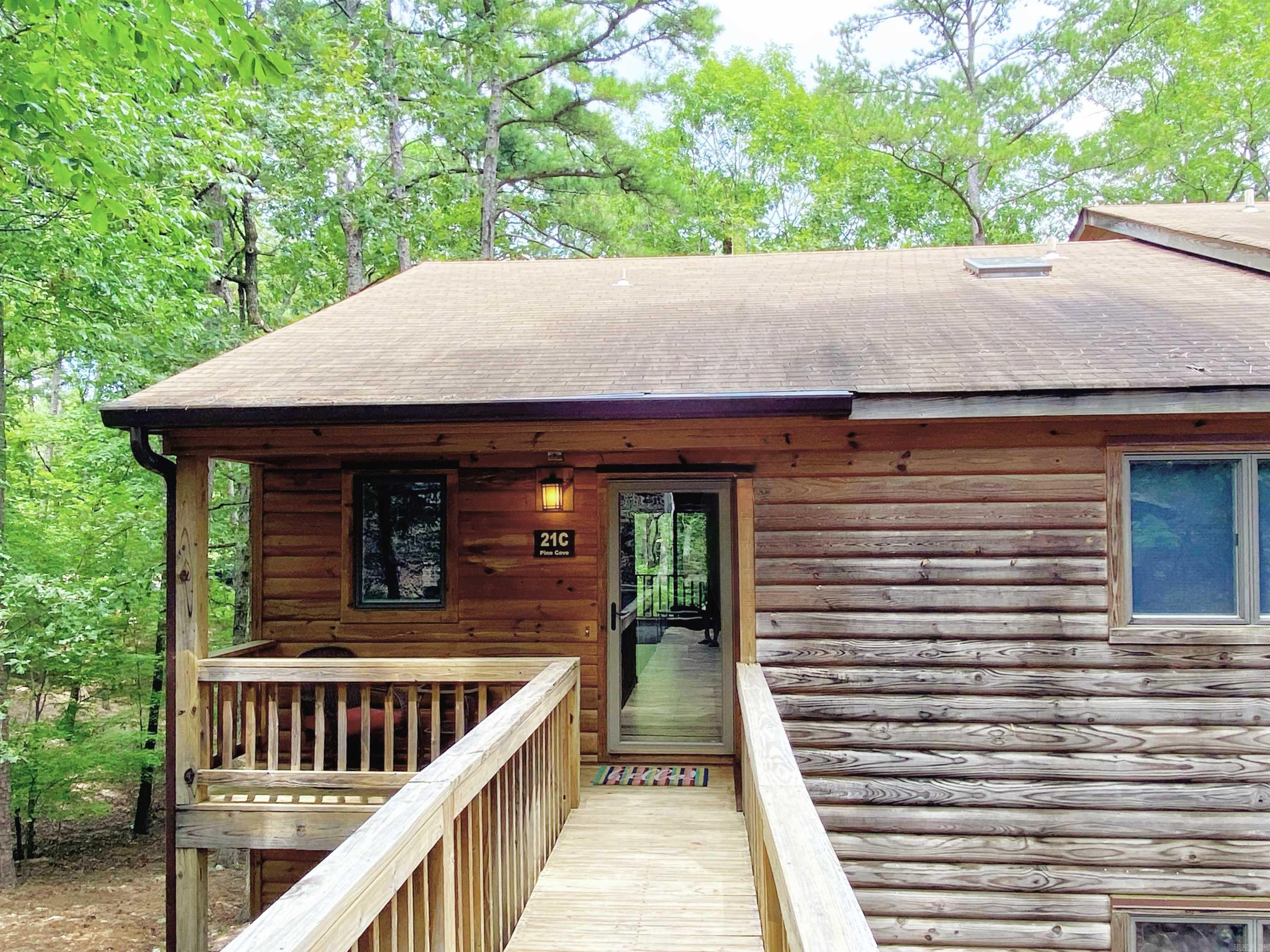 Welcome to The Treetop Getaway, a beautifully updated 2-bedroom, 2-bath top-floor corner condo located in the highly sought-after Mountain Harbor Resort on the shores of pristine Lake Ouachita. This bright and spacious condo features vaulted ceilings, abundant natural light, and wooded views from your private back deck where deer often roam. The updated kitchen includes granite countertops, stainless steel appliances, and comes fully equipped. Offered fully furnished, including dĆ©cor, linens, kitchenware, and more ā this is truly a turnkey opportunity, ideal as a personal retreat, vacation home, or income-generating investment. Nearby you will find two swimming pools, and courts for pickleball, tennis, and basketball. A close walk or drive to the lakeshore and outdoor enthusiasts can take advantage of miles of trails for walking, mountain biking, or ATV adventures. Currently listed on VRBO and Airbnb under āThe Treetop Getaway,ā this unit has an established presence and rental history, making it a rare opportunity in one of Arkansasās premier lake destinations. Agent owned!