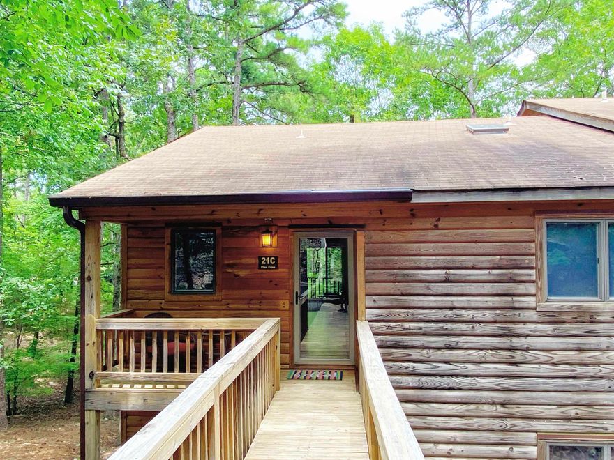 Welcome to The Treetop Getaway, a beautifully updated 2-bedroom, 2-bath top-floor corner condo located in the highly sought-after Mountain Harbor Resort on the shores of pristine Lake Ouachita. This bright and spacious condo features vaulted ceilings, abundant natural light, and wooded views from your private back deck where deer often roam. The updated kitchen includes granite countertops, stainless steel appliances, and comes fully equipped. Offered fully furnished, including décor, linens, kitchenware, and more – this is truly a turnkey opportunity, ideal as a personal retreat, vacation home, or income-generating investment. Nearby you will find two swimming pools, and courts for pickleball, tennis, and basketball.  A close walk or drive to the lakeshore and  outdoor enthusiasts can take advantage of miles of trails for walking, mountain biking, or ATV adventures.  Currently listed on VRBO and Airbnb under “The Treetop Getaway,” this unit has an established presence and rental history, making it a rare opportunity in one of Arkansas’s premier lake destinations. Agent owned!