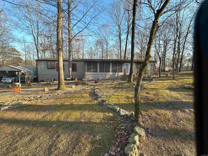 Welcome to this charming two bedroom, two bath house situated on a spacious nearly three and a half acre lot.  As you step inside you immediately notice the warm and inviting atmosphere.  One of the unique features of this property is the separate living quarters that could be used as a mother in law suite or rent it out.  The versatile space offers a living space, small kitchenette, and bathroom.  The outside is set up perfectly for a cozy place to sit by the fire and enjoy all nature has to offer. USDA eligible