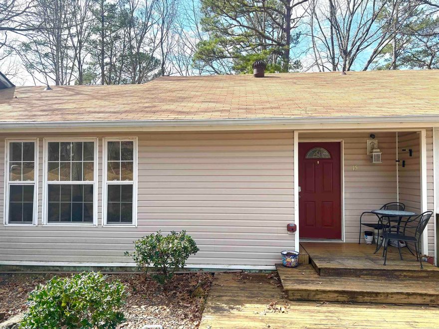 Welcome to this beautiful townhome in Hot Spring Village.  They main level features durable LVT flooring and an open concept layout what seamlessly connects the kitchen eat-in dining area, and living space-perfect for everyday living and entertaining.  The kitchen is equipped with newer stainless steel appliances and offer excellent functionality.  Refrigerator conveys as is no value.  Step out back to enjoy a nice deck ideal for relaxing. Upstairs, the walk-in shower has been updated, adding a modern touch.  Downstairs you will find 2 comfortable bedrooms, full bath, dedicated laundry area and spacious storage room.  This townhome combines comfort, updates and low maintenance living in a desirable community setting.   SOLD AS IS - SELLER WILL MAKE NO REPAIRS. AGENTS SEE REMARKS