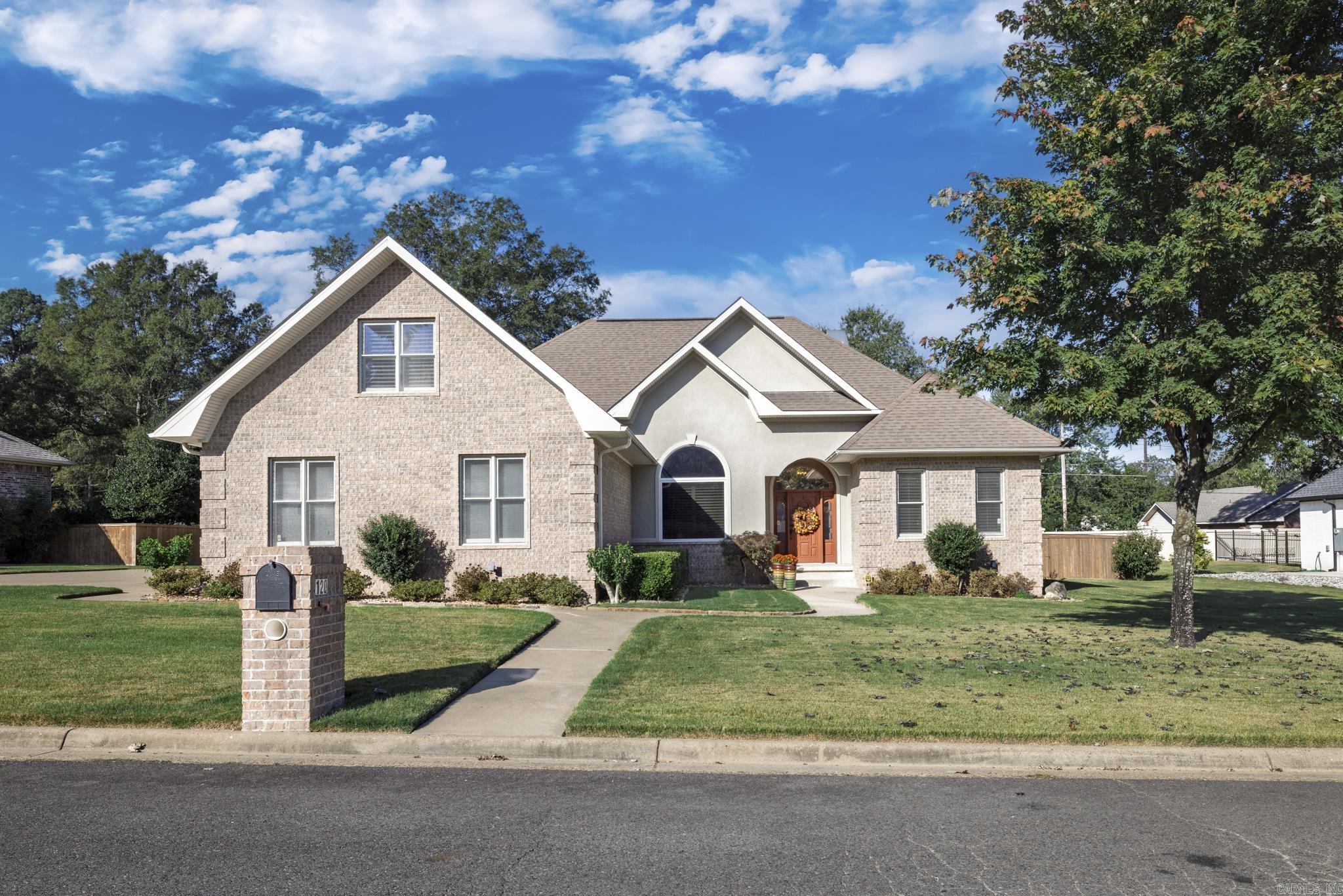 Enjoy the perfect blend of elegance and comfort in Hot Springs! This beautiful 4-bedroom, 2-bath home features an inviting open-concept floor plan with hardwood floors, a cozy fireplace, and a dining area ideal for family gatherings. The kitchen shines with granite countertops, plenty of cabinet space, and views into the main living area. The spacious en-suite offers two large walk-in closets, a luxurious jetted tub, and an upgraded tile shower. Upstairs, a versatile bonus room serves perfectly as a 4th bedroom, office, or media space and includes a full wall of closets for extra storage. Enjoy plantation shutters throughout, a striking 13-foot entry ceiling, and a large fenced backyard perfect for outdoor entertaining or pets. Conveniently located near shopping, dining, and Hot Springs amenities—this home has it all!
