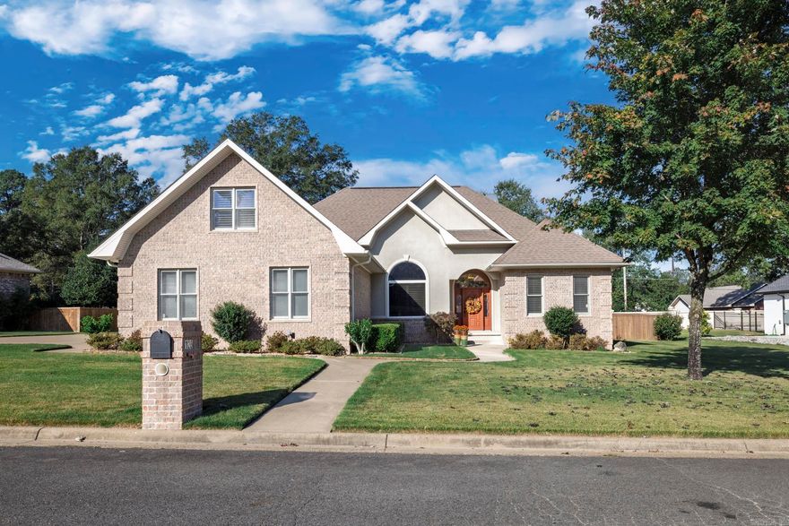 Enjoy the perfect blend of elegance and comfort in Hot Springs! This beautiful 4-bedroom, 2-bath home features an inviting open-concept floor plan with hardwood floors, a cozy fireplace, and a dining area ideal for family gatherings. The kitchen shines with granite countertops, plenty of cabinet space, and views into the main living area. The spacious en-suite offers two large walk-in closets, a luxurious jetted tub, and an upgraded tile shower. Upstairs, a versatile bonus room serves perfectly as a 4th bedroom, office, or media space and includes a full wall of closets for extra storage. Enjoy plantation shutters throughout, a striking 13-foot entry ceiling, and a large fenced backyard perfect for outdoor entertaining or pets. Conveniently located near shopping, dining, and Hot Springs amenities—this home has it all!
