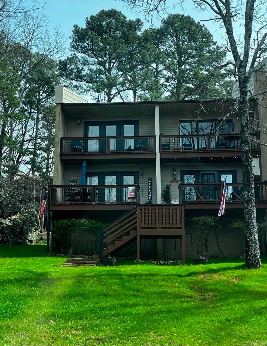 This condo is just 3 mins from the cool pool nestled in the heart of a lake town resort community, this turn-key 2-bedroom, 1.5-bath condo is your gateway to year-round adventure and relaxation. Perfectly updated & ready for immediate enjoyment, it includes everything you need furnished down to the linens and dishes minus just a few cherished personal items. Step inside to gleaming new luxury vinyl plank floors that flow seamlessly throughout, complemented by fresh paint in soothing neutrals that amplify the natural light pouring through updated windows. The kitchen shines with brand-new appliances, countertops & trendy shelving for effortless entertaining. Cozy up, living area with plush new decor, or retreat to the spacious primary bedroom. The second bedroom offers versatility as a guest room or home office, while the full bath features modern fixtures and ample storage. Outside, vibrant green grass blankets the front and back yards, creating an inviting oasis. Unwind in the charming front porch sitting area with morning coffee, or enjoy grilling steps from the kitchen area, or head upstairs to the private balcony for sunset views . The upper deck beckons for sunset views as