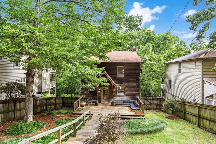 4611 North Lookout offers the perfect combination of classic Hillcrest charm and modern updates, ideally located directly across from the trailhead at Allsopp Park. This beautifully maintained 3-bedroom, 3-bath home features approximately 2,167 square feet filled with natural light, gorgeous views, and thoughtful upgrades throughout.  Inside, you’ll find beautiful all-wood flooring, a warm wood-burning fireplace, and an updated kitchen with granite countertops and timeless finishes. Each bedroom is paired with a private bath, creating comfort and convenience for family and guests alike. Large windows throughout the home showcase incredible views of nature and flood every room with sunlight.  Step outside to three levels of decks overlooking the park, creating the perfect spaces for entertaining, relaxing, or enjoying peaceful mornings surrounded by nature. Located within walking distance to everything Hillcrest has to offer, this home is the ideal blend of location, character, and lifestyle.