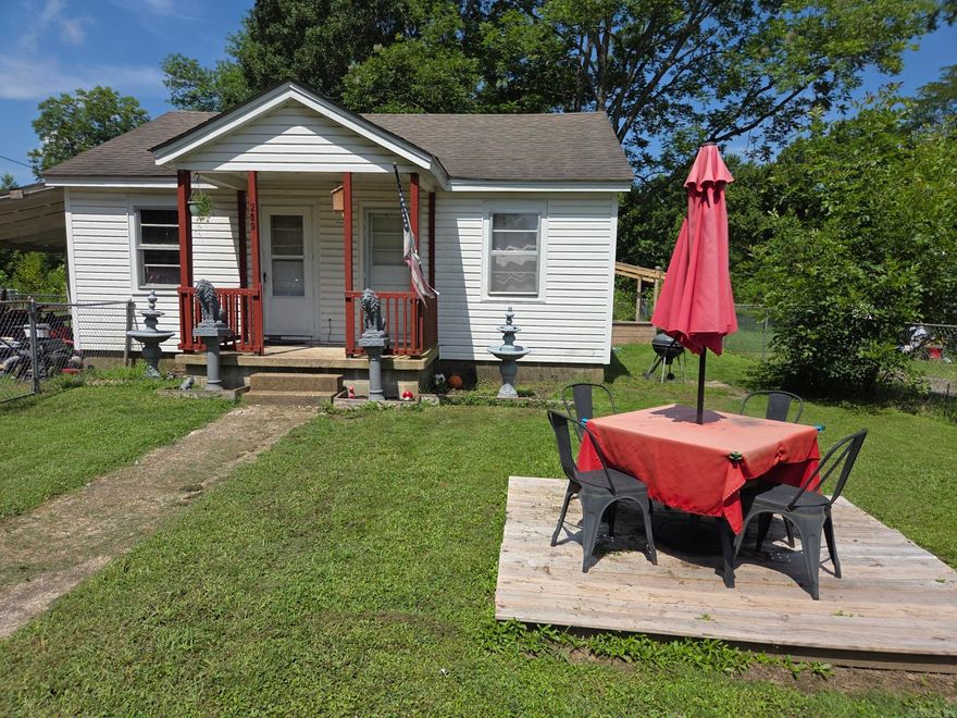 This 2 bedroom, 1 bath little house has a one car carport & a fence around entire yard. The kitchen has an electric stove & there is a new electric water heater in the bathroom closet. Separate laundry that has a backdoor leading to a large deck on the back. Window units for Air with gas wall furnaces for heat. Needs some cosmetic improvement & a little TLC but would make a good rental or starter home. Seller says it has all new plumbing under the house. Please give a 24-hour notice to show. See agent remarks.