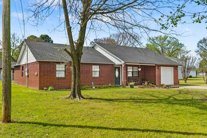 Welcome to this beautifully maintained all-brick home situated on a spacious half-acre lot, offering the perfect blend of comfort, functionality, and country charm. This inviting property features three bedrooms and two full bathrooms, providing a practical layout suited for everyday living.  The home has been lovingly cared for over the years and offers a warm, classic feel throughout. Its solid construction and timeless character provide a great opportunity for buyers to make it their own.  One of the standout features is the versatile outdoor space. Fully fenced in yard to include a 18x20 heated and cooled shop—ideal for hobbies, projects, or additional workspace. The original garage has also been thoughtfully converted, creating even more room for storage or a dedicated work area.  With plenty of space both inside and out, this property is perfect for those seeking a well-kept home with room to spread out, all in a peaceful setting.