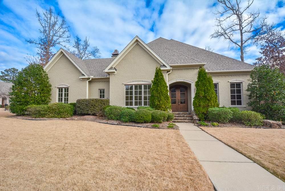 Custom country French home in gated Chenal CC Bear Den Course. 3 Bedrooms on main level and one bedroom with theater upstairs. Barrel foyer, built-ins in study, hearth room with site built stone fireplace; 12" ceilings. Gourmet kitchen has full slab granite, double oven and large island. Stadium seating in theater, cedar closet and covered veranda. $5,000 Carpet allowance. New paint, appliances and roof.