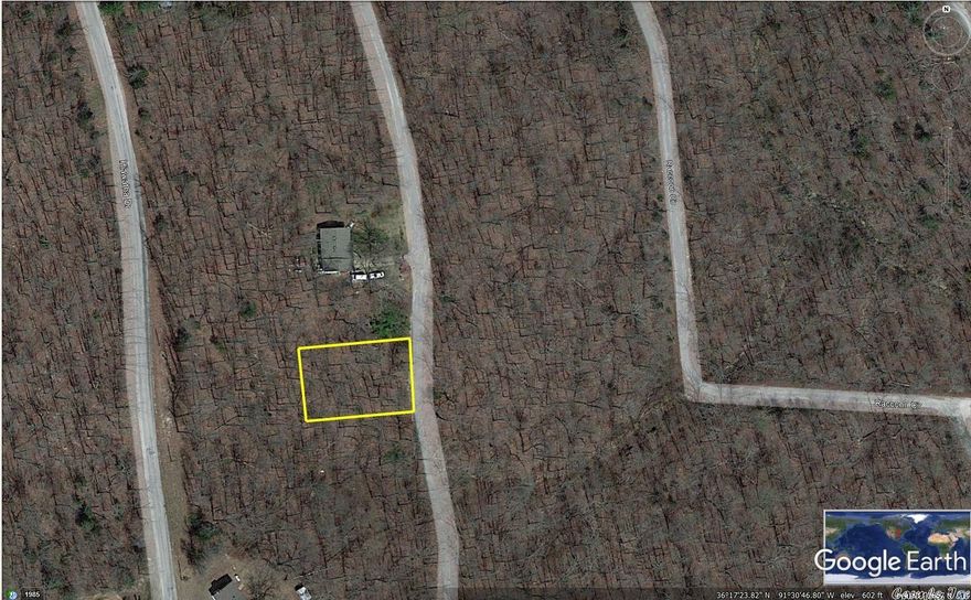 Nice lot on the East side of Cherokee Village. Just moments out to the 4 Lane to get to shopping, dining and entertainment. Just 1/2 a mile from the sandy beach at Gitche Gumee swimming beach on Lake Sequoyah. This lot has a wonderful uphill slope that lets your front porch overlook the wooded valley across the street with its wet weather creek and all the wildlife you care to see. Come buy your lot, move in and enjoy 7 Lakes, Two 18-hole golf courses and the Southfork river in wonderful Cherokee Village.