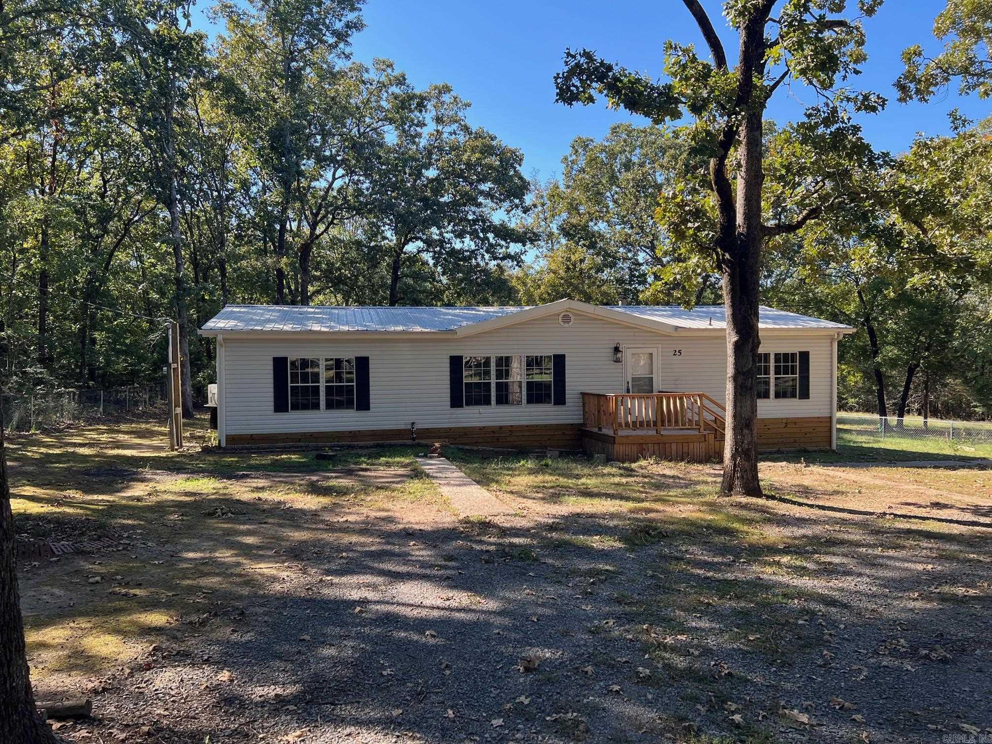 Updated Modular Home on 1.67 acres +/- Three bedroom Two bath, Home has been updated and is ready for the new owner. New LVP flooring throughout the home. Fresh Paint, New mini splits, updated door knobs and plumbing fixtures. Home has a fenced yard and lots of shade trees. Comes with a small garage/workspace and a camper shed.