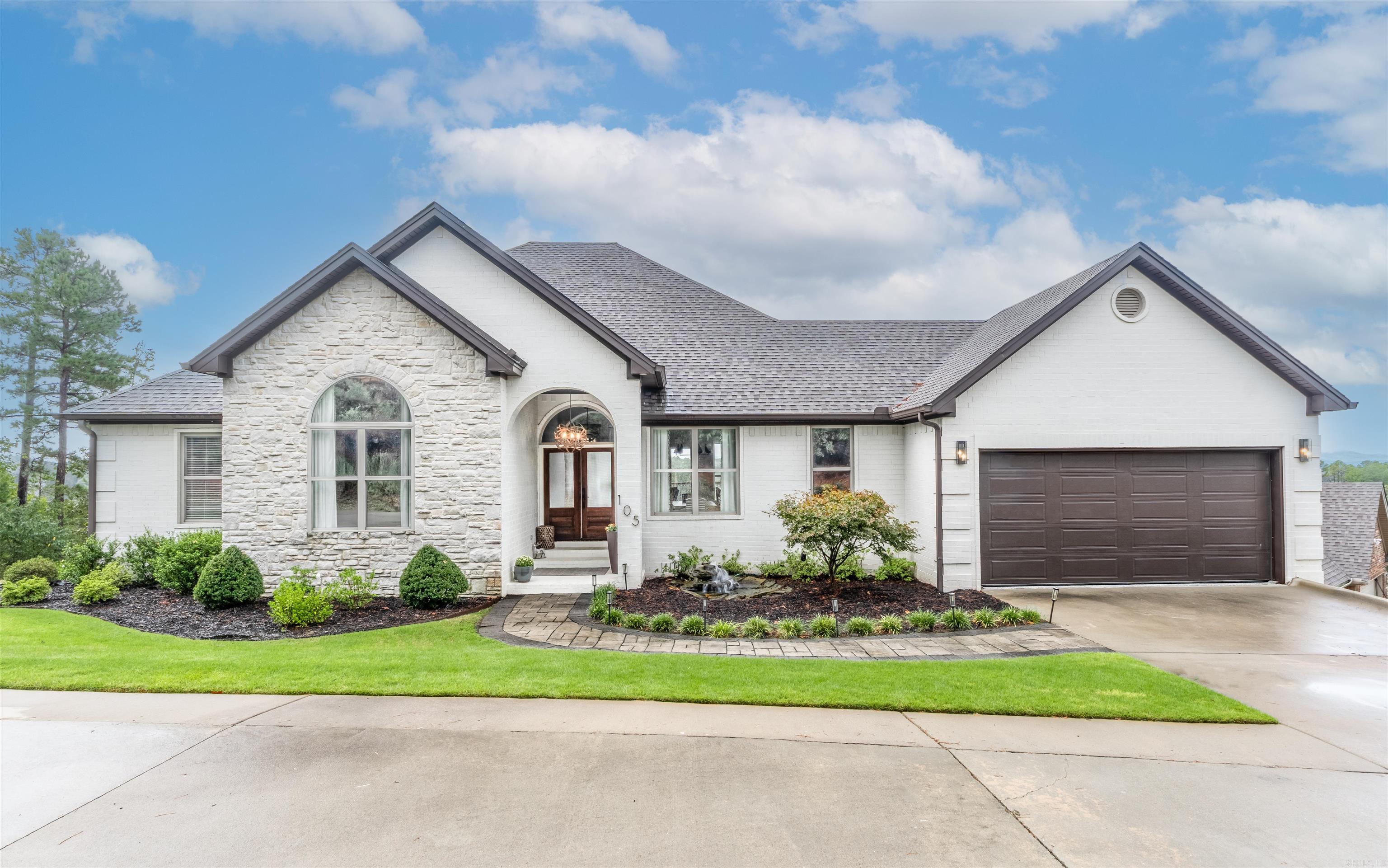 This exquisite custom built home showcases high-end finishes throughout, offering both elegance and comfort. Enjoy breathtaking view of Pinnacle Mountain from the expansive deck and through large windows that fill the home with natural light. Every detail has been thoughtfully designed to create a serene and luxurious living experience. Kitchen features ceiling height cabinets, wall oven, built in microwave, stainless appliances and farm sink. Main bathroom has dual sinks, tons of storage, walk-in closets, soaker tub and a sleek shower. Rich acacia hardwood throughout most of the home with tile in bathrooms. Features of the laundry room include sink, generous cabinet storage and a cozy window seat with storage underneath. Surround sound in family room, pool room and on the deck. Garage has mini split, epoxy floors. Beautiful view of Pinnacle Mountain from the partially covered deck to watch amazing sunsets. Storage area under the home.