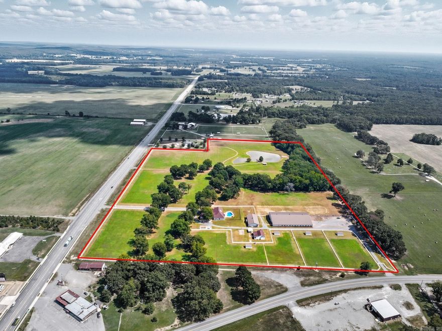 Welcome to 1801 Hwy 64 West, where luxury country living meets world-class equestrian facilities. This extraordinary 51.23± acre property in El Paso, Arkansas is purpose-built for serious horse enthusiasts, trainers, and breeders—offering everything you need to live, work, and ride in style. This facility is ideal for year-round training, riding, breeding, practicing, and hosting clinics.  Indoor Arena: 80’x156’ Riding size Rockin J stalls with sliding doors, swing out feeders, stable grid over pea gravel, and fly spray system Climate-controlled observation lounge with kitchen, bar, full bath Large wash bay  Stall Barn: 85’x48’ with concrete floor Rockin J stalls with stable grid on pea gravel, sliding doors, and swing out feeders  Outside Highlights: Five turnouts with loafing sheds Expansive Pastures: Lush, fenced acreage ideal for grazing, training, and turnout – fenced and cross fenced  Main Residence Highlights: Gourmet kitchen with Viking appliances Expansive porches front and back Outdoor kitchen overlooking a sparkling saltwater pool  Detached guest room with full bath Gated entrance  Second Home Features: 1,700 sq ft of open-concept living Ideal for guests or caretakers