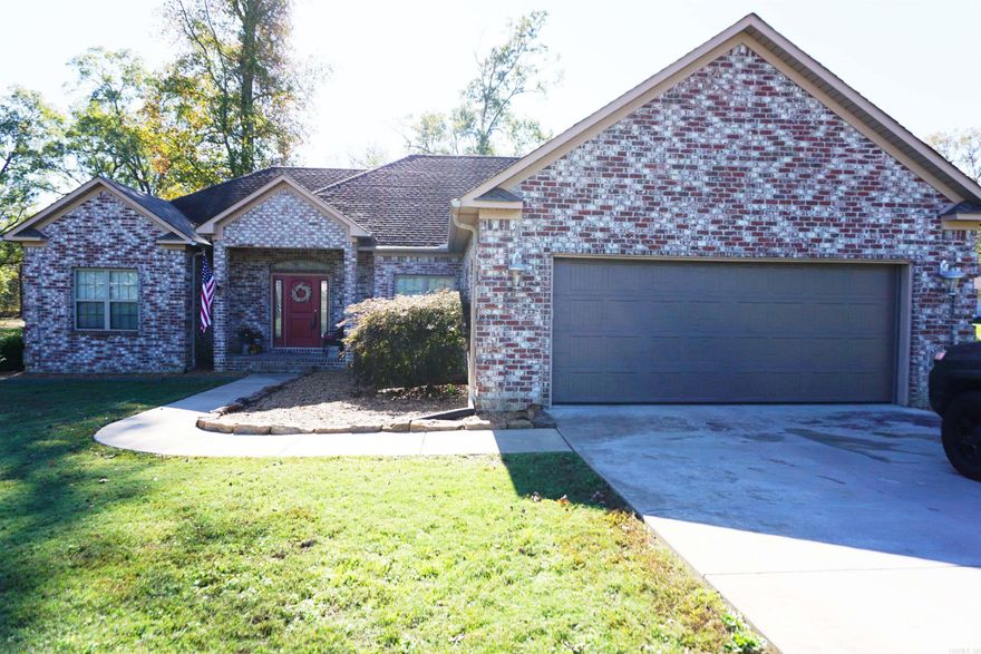 Wonderful Beautiful Brick home sitting on 1.52 acres. Very open living space with a gas log fireplace, tons of space for your furniture, beautiful cabinets in the kitchen, nice Stainless appliances, tons of windows and has been freshly painted a light neutral color. Large primary bedroom with an amazing walk in closet that connects to the laundry room which is super convenient, and a beautiful en suite bathroom with separate shower and jetted tub, double vanity with new mirror.  Laundry room also has storage cabinets. 2 spare bedrooms are great size and have nice closets. Main bath is very pretty and has a tub shower unit. Large double garage with storage space and a brand new garage door and side mount garage door opener. Back yard has a wonderful back porch and a pergola and mature trees for nice shade. New Central Heat and Air Unit installed in 2024.  Such a quiet pretty area that is just far enough out of town for peace but close enough for convenience.