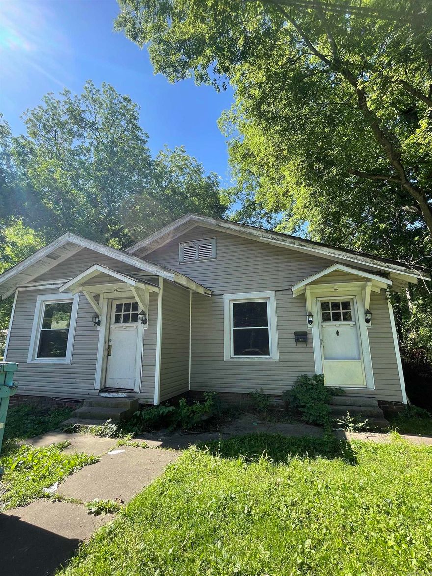 Former duplex converted into a spacious single-family home—perfect for an investor with vision! This property offers plenty of square footage and flexibility, with multiple living areas and entrances that hint at its duplex past. While it needs significant updates and repairs, the layout provides a strong foundation for customization and value-add opportunities. Located in a growing area with rising home values, this is an excellent chance to bring new life to a classic structure and create long-term equity. Whether you're flipping or adding to your rental portfolio, the potential here is real.