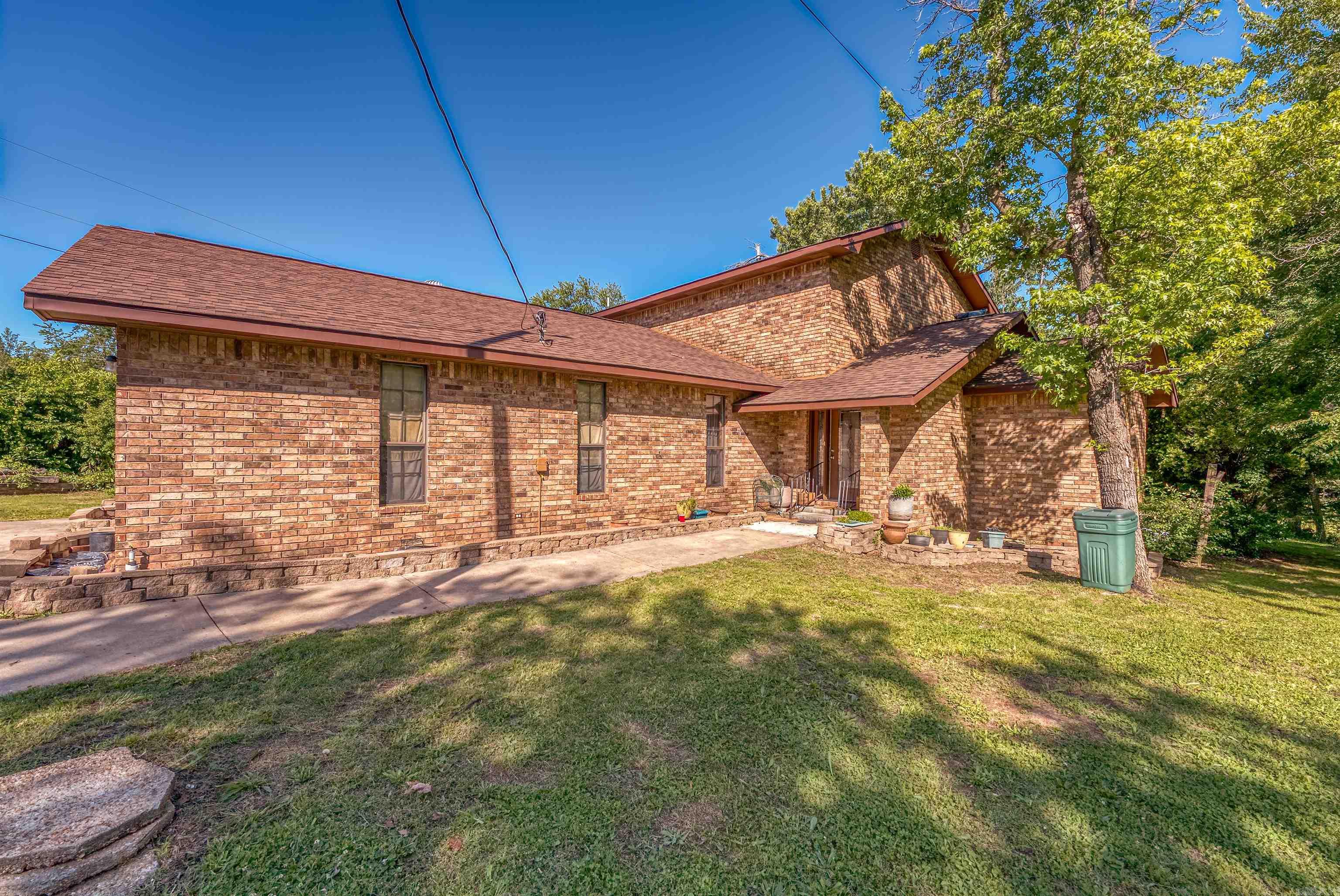 HOME ONLY! Charming 3,200 sq ft brick home on 2 unrestricted acres just outside Marshall, AR. Features a hand-forged iron spiral staircase leading to two upstairs master suites with tiled en suites. Main floor includes a third master with private access to hall bath and pool patio, with two additional bedrooms, and an office/study down the hall. The kitchen has tile flooring, oak cabinets, and a breakfast bar overlooking the dining area with access to the back deck. Enjoy a cozy sunken living room off the foyer. Outside, there’s a large in-ground pool (needs TLC) There is plenty of room for gardening or animals, no restrictions. Located at the corner of Hwy 27 & Barren Hollow Rd, just 3.5 miles from Marshall, just minutes to several Buffalo River access points, & 1 hr 45 mins to Branson, MO. A rare blend of space, charm, and functionality in the Ozarks!