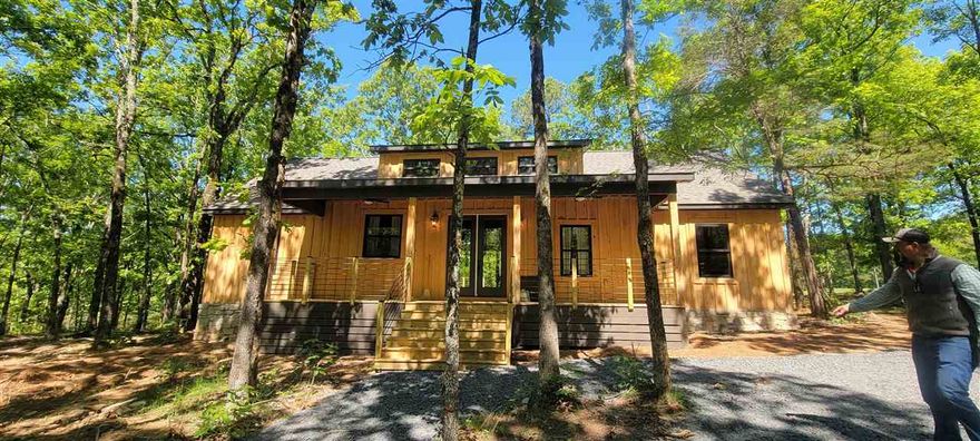 Welcome to Market New Construction home on the Golf Course in Tannenbaum. This new build will have three bedrooms, 2 baths, vaulted ceilings, large open floor plan. This home over looks the #2  hole on Tannenbaum golf course and a pond. approx. two miles is a boat ramp and picnic pavilion. Also working on  path to lake from the house.  More details to come, house is in under new construction at this time, but come and see today.