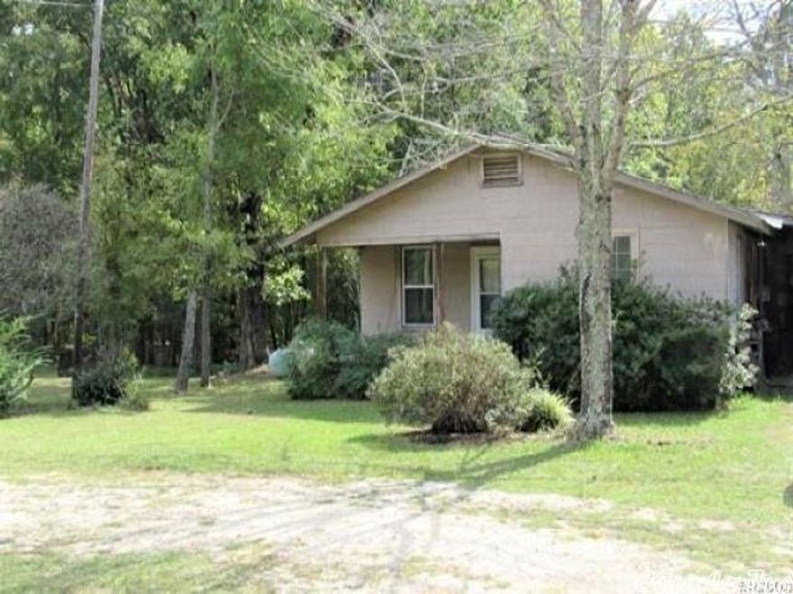 House for sale with one acre that needs work.  Selling "as is"