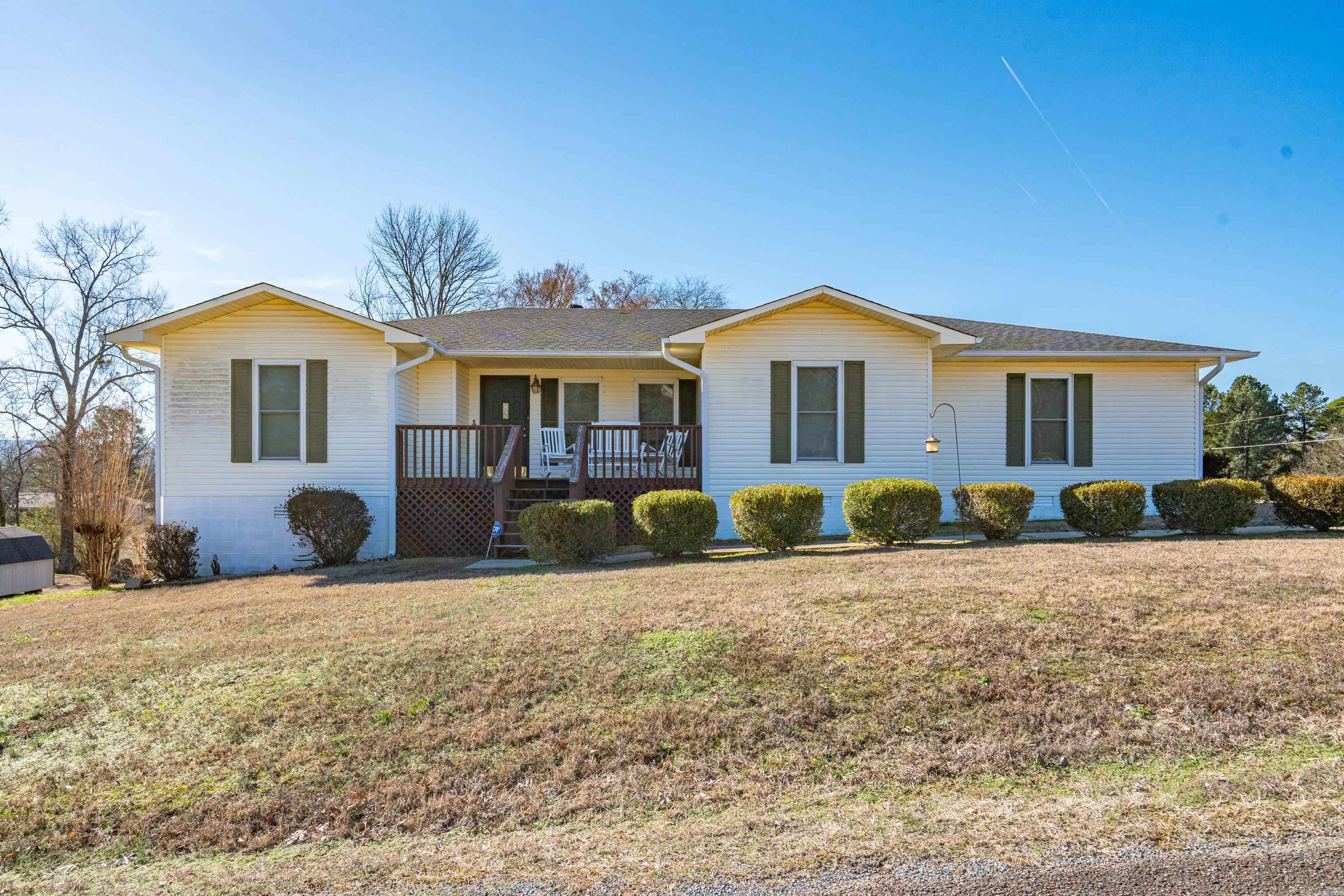 This well-kept home sits on a corner lot in the established Compadre Estates neighborhood, near Lake Hamilton School. Its smart, split floor plan offers privacy coupled with the convenience of having everyone on the same level. The primary suite is spacious enough to accommodate a sitting area + huge closet and 4 piece bathroom. This home is well-kept and as clean as they come. Upgrades include: recently replaced roof, insulated windows, wood/vinyl flooring, and more. Enjoy front porch sitting or entertaining on the large back deck. Make this your forever home.