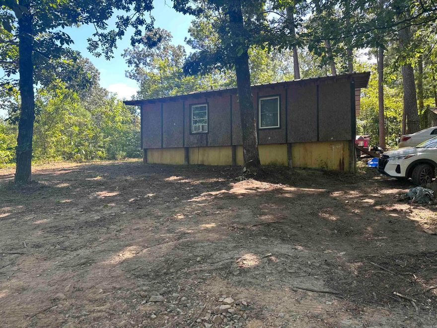 768SF 3BR CABIN MINUTES FROM DEGRAY LAKE LIVE & ONLINE REAL ESTATE AUCTION SELLING TO THE HIGHEST BIDDER AT OR ABOVE  THE OPENING BID OF $20,000 THURSDAY, AUGUST 21 @ 12 NOON   LOCATION: 472 Beech Drive, Amity, AR 71921.  This property is on a one-acre wooden lot in the country with well water.  It is on a gravel road only a short distance from DeGray Lake and Highway 84.  This would make a good weekend getaway, rental property or starter home.  It will be selling with live onsite and online bidding.     VIEWING: Saturday, August 16 from 2:00-4:00PM, or doors will be open one hour before the auction.             TERMS: There will be a 10% buyer’s fee added to the final bid to determine the final contract price.  We will require $3,000 down day of auction as non-refundable earnest money if you are the successful bidder with balance due at closing in 30 days.