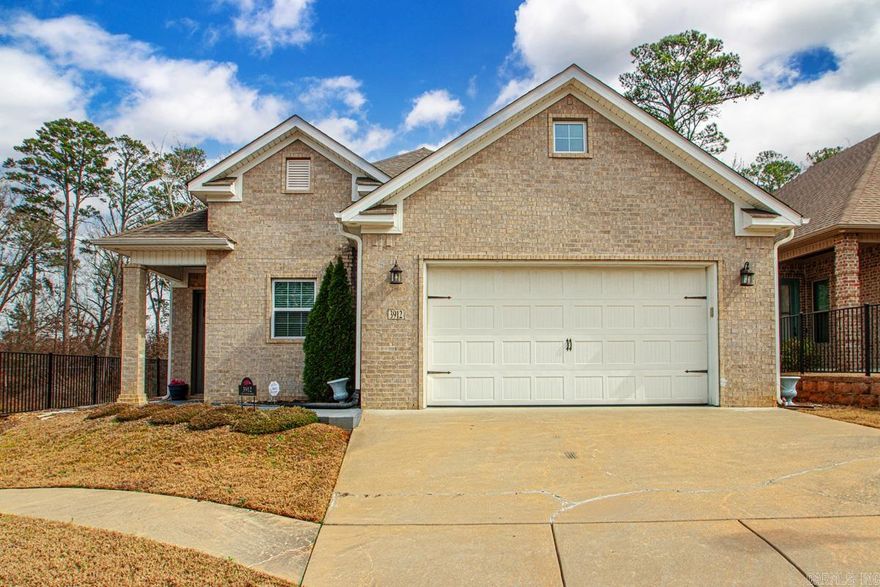 Located in Bryant’s GATED Hunter Crossing neighborhood, this 3-bedroom home offers comfort, security, and an ideal layout for everyday living. The open floor plan showcases gorgeous wood flooring and abundant crown molding throughout the main living areas, along with a spacious kitchen featuring granite countertops, abundant cabinetry, an island with bar seating, and a convenient built-in desk. The dining and living spaces are anchored by a two-sided gas fireplace, creating a warm and inviting atmosphere.  The primary suite continues the detailed crown molding and wood flooring and includes a generous walk-in closet and an impressive custom-tiled shower. Step outside to a level, fully fenced backyard that’s easy to maintain, complete with a covered patio and a storage building built to match the home.  Energy-efficient upgrades include foam insulation and a tankless water heater, plus a security system already in place and fiber internet available. A built-in safe room adds an extra layer of peace of mind.  Move-in ready and priced at $284,900!  Schedule your showing today!