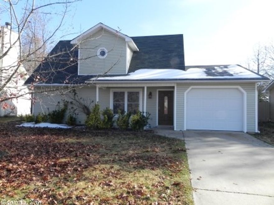 Newly renovated house in nice neighborhood with new energy efficient windows, new paint, carpet, light fixtures, metal garage door, and energy efficient tank less water heater. Master bedroom on lower level with walk in closet, and 2 bedrooms on upper level. A full bath on each level. Nice large carpeted living room; kitchen and dining room combination with beautiful tile floors. Exterior has gutters and vinyl siding for low maintenance. Fully fenced backyard with wood privacy fence and concrete patio.