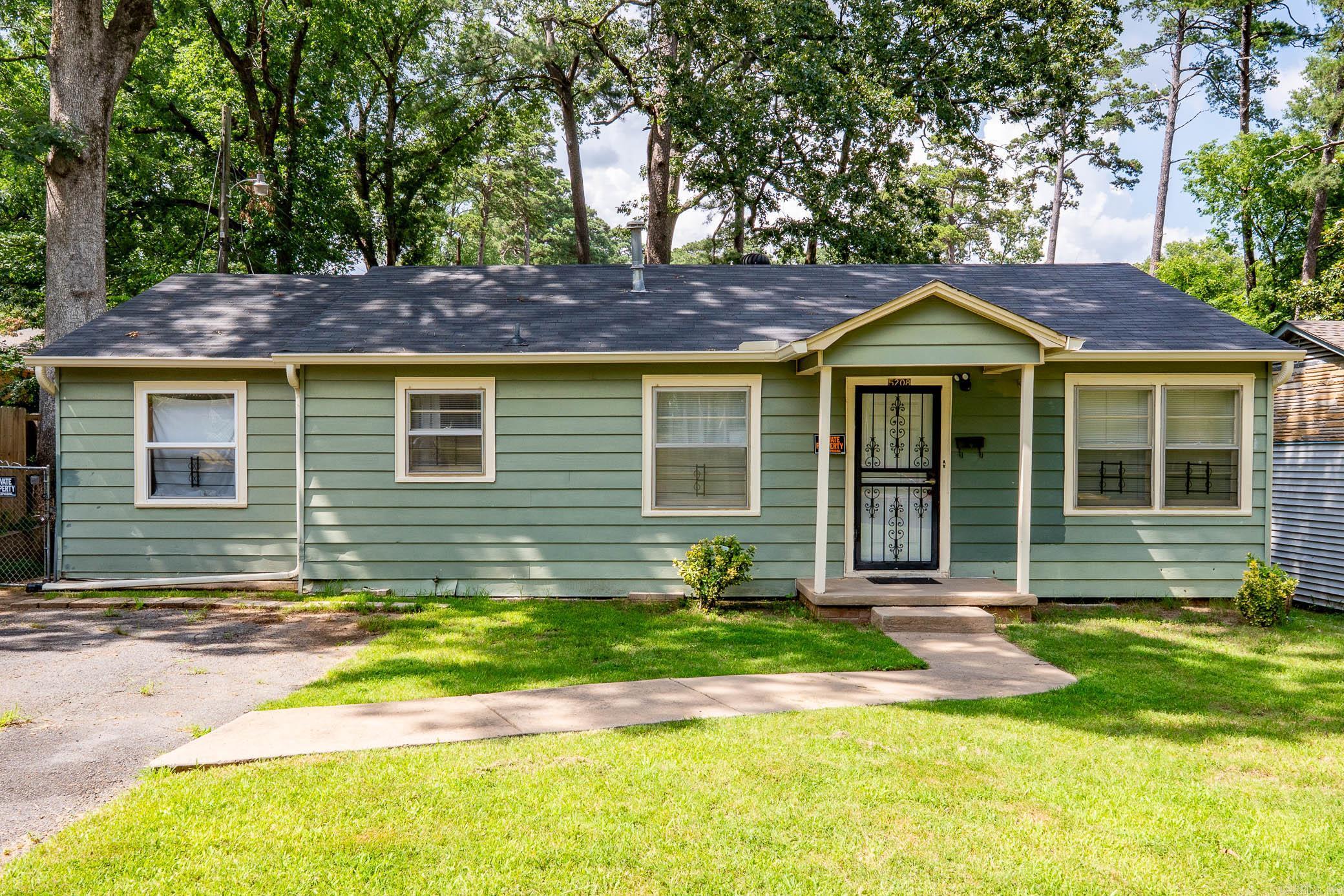 Welcome to 5208 W 24th Street in Little Rock, AR! This charming 3-bedroom, 1-bath home offers 1,130 square feet of comfortable living space. Nestled in a quiet neighborhood with mature trees. Inside, you’ll find warm hardwood-style floors, a cozy living area with natural light, and a practical layout perfect for efficient living. The bedrooms are generously sized, and the home has been well-maintained with neutral tones ready for your personal touch. The kitchen and living room flow nicely for everyday living and entertaining. With a fenced backyard and ample driveway parking, this property offers both comfort and convenience just minutes from parks, schools, and shopping in the heart of Little Rock.