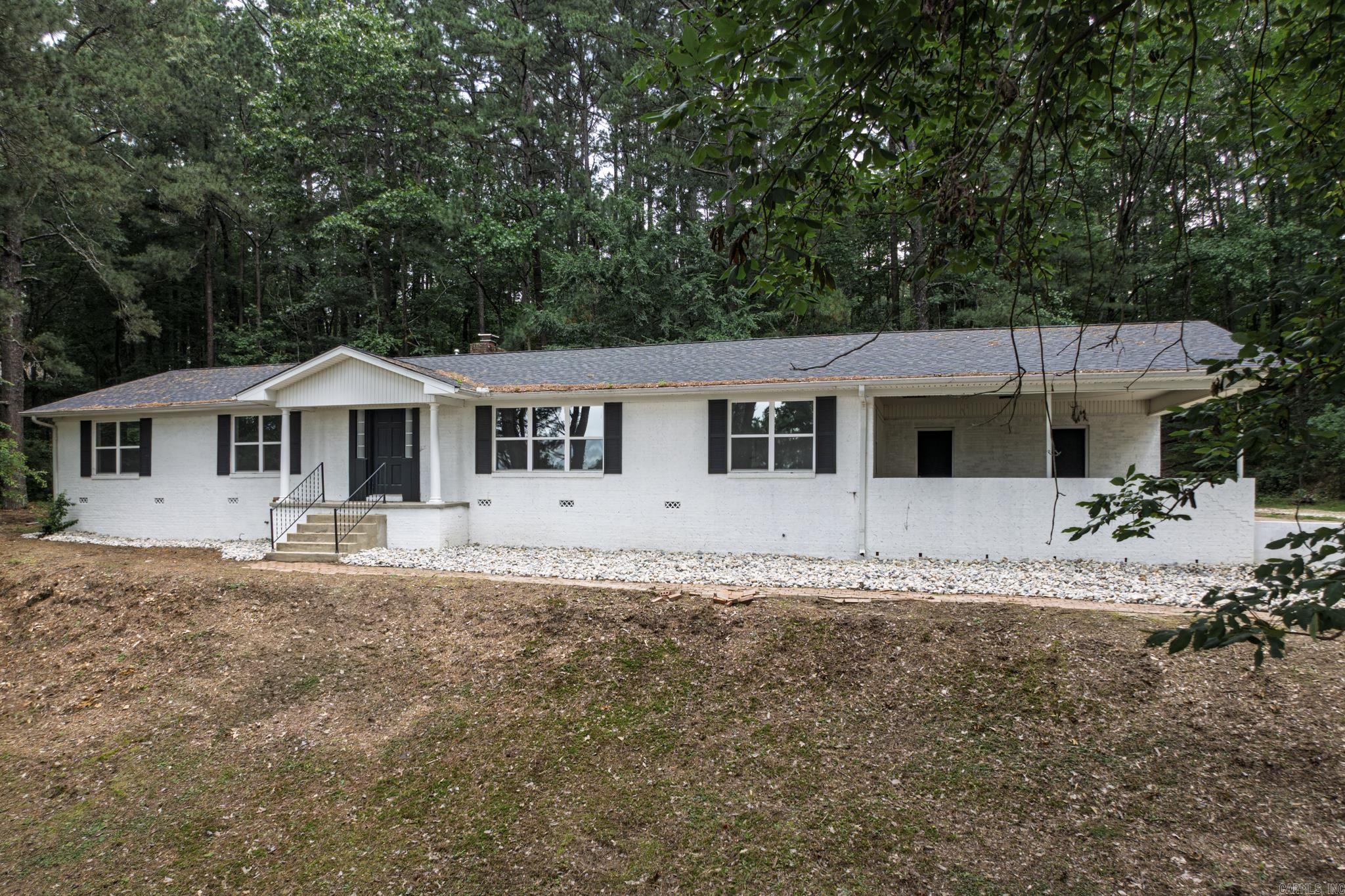 This beautifully remodeled 3-bedroom, 2-bath home is perfectly located in a desirable subdivision adjacent to Ouachita Baptist University. The home boasts a spacious living room and an additional office space, offering ample room for work and relaxation. A cozy den with a natural log fireplace provides the perfect retreat, while the open-concept eat-in kitchen features modern finishes and a large walk-in pantry. The master suite is a true highlight, with an oversized walk-in shower for a spa-like experience. Outdoors, the property offers abundant storage space and a unique setting, backing up to trails that extend to the scenic Ouachita River. This home combines style, functionality, and a prime location, making it a must-see!