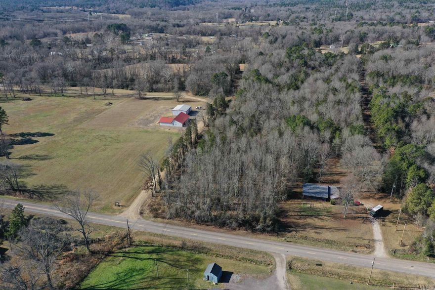 Located less than a quarter mile off of Highway 22 in Delaware, this Logan County build site is perfect for those with convenience in mind. The 5.7 +/- acre property has frontage on both Fire Dept. Loop, as well as Wood Lane, providing great access to the property’s two build sites. With the access from both county roads, the property would be a prime candidate for a minor subdivision. Power, rural water, and fiberoptic internet are all available along the property’s county road frontage, perfectly complementing the great access and adding another level of convenience. Dardanelle is less than fifteen minutes away, and Russellville less than twenty, making this a very commutable location for those working in town every day. Lake Dardanelle, known for its great fishing, has several boat ramps, day use areas, and campsites nearby. If you are looking for a build site in the country, that offers a level of privacy but does not compromise convenience, you will want to take a look at this one.