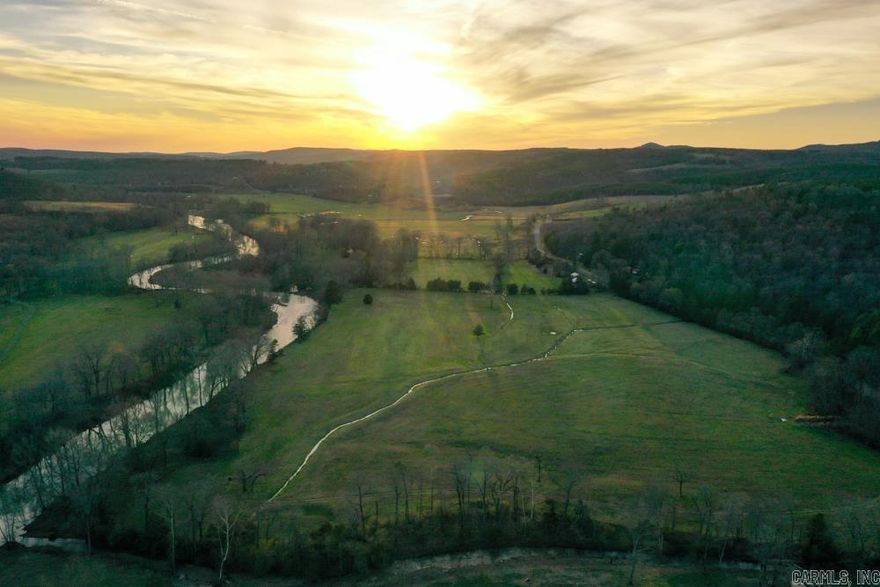 Welcome to this exceptional 76 +/- acre property posting nearly half a mile of river frontage along the South Fork of the Little Red River. Rarely does a tract with so much potential, God-given beauty, and uniqueness come available. The land features meticulously, fenced and cross-fenced pastures, perfect for livestock or agricultural endeavors. Nestled on the ridge you’ll find mature timber, adding to the natural beauty and providing a peaceful retreat from the hustle, and bustle of everyday life.  Convenience meets tranquility with access to electricity, fiber Internet, and water, making this property not only a scenic oasis but also a practical choice for modern living. Located just a short five minute drive from Clinton, Arkansas you’ll enjoy the best of both worlds, the peace and privacy of rural living with the amenities and services of a nearby town.  Whether you’re looking to build a dream home, start a farm, or simply escape to nature, this property offers endless possibilities. Embrace the beauty of the riverfront, the tranquility of the pastures, and the charm of the mature timber to make this your own piece of heaven on earth.