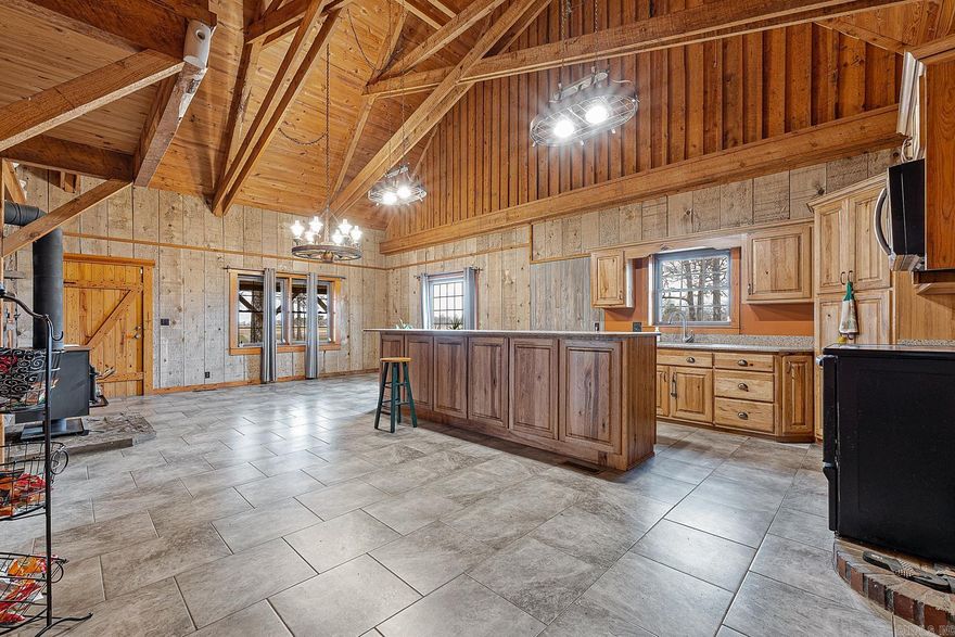 Welcome to your serene retreat just outside Corning, Arkansas, where rustic charm meets modern comfort on 6 acres in the Arkansas Delta. Located just south of the Missouri border and just a few short miles from one of Arkansas’ most renowned waterfowl flyways, the Black River, this 2,066 square foot, 3 bedroom, 1 bath home is crafted from local cypress, offering durability and timeless appeal. Step inside to discover an updated open kitchen, adorned with new floors that lead you through the inviting living spaces.  The heart of the home features a cozy gas log insert fireplace, perfect for chilly evenings, complemented by new central heat and air for year-round comfort. The architecture of the home will leave nothing wanting, with large sawmill cypress beams and old sawn lumber.   Outside, the property boasts a 40'x50' shop with impressive 20' ceilings and an 18' door, ideal for storing equipment or pursuing hobbies. Attached to this is a charming 30'x40' cypress shop, blending seamlessly with the natural surroundings. Surrounded by sprawling oak trees, the expansive yard offers ample space for outdoor activities, gardening, or just enjoying your peace and tranquility!