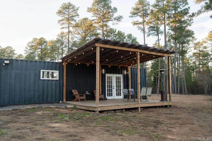 Escape to the woods with this versatile 30-acre property offering privacy, convenience, and endless possibilities. Whether you’re searching for a hunting retreat, a peaceful getaway, or the perfect spot to build your dream home, this property delivers. A shipping container–converted studio tiny home is already in place, featuring a spacious covered porch ideal for relaxing and enjoying the surrounding wildlife. A private, winding driveway leads to a cleared homesite, ready for future construction or continued enjoyment of the existing tiny home. The property offers access from both S Sawmill Road and Jackson Road and includes established septic, public water, electric, as well as fiber internet. Use it as a weekend cabin, a temporary residence while you build, or your own private hunting retreat in the woods.