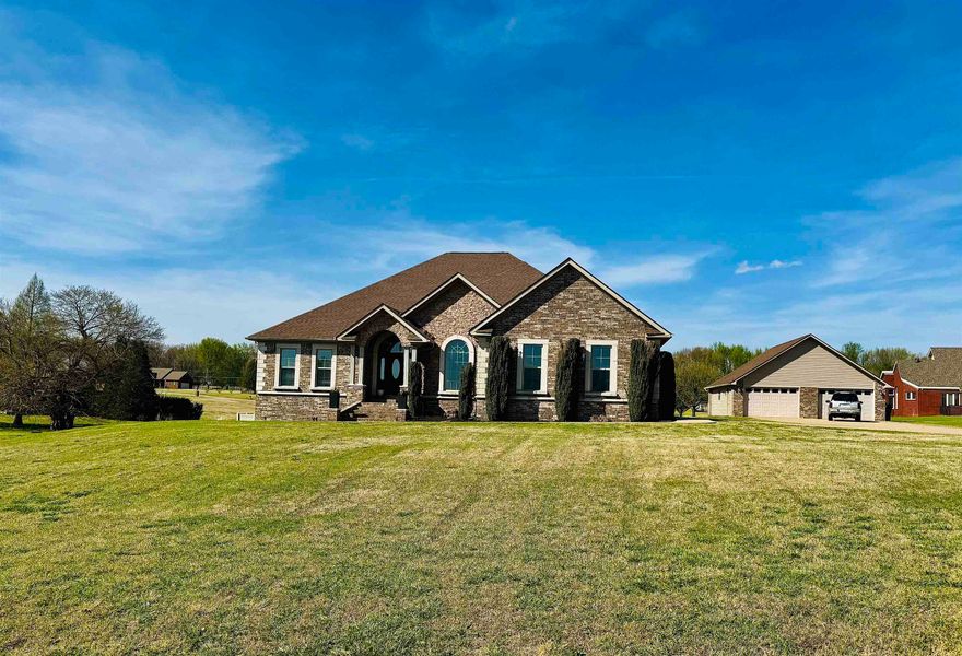 Welcome to North Pointe Estates! This spacious 4-5 bedroom, 4 bath home offers approximately 5,140 sq ft of living space on 1.93 acres. Built in 2011, this property combines generous indoor living with exceptional outdoor and entertaining features. The main level offers a grand entry, formal dining, spacious kitchen, and inviting living area with fireplace. The full finished walk-out basement is designed for entertaining and includes a wet bar, theater room, safe room, and flexible space for recreation, guests, or hobbies. Step outside to enjoy the saltwater inground pool, elevated deck, and additional patio space. The property also features a 2-car attached garage, an additional 2-car detached shop/garage, and a geothermal system for added efficiency. A rare opportunity in the highly desired North Pointe Estates subdivision. Westside Schools