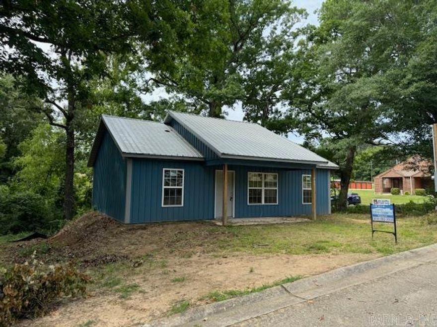 NEW CONSTRUCTION READY TO FINISH!  We’ve started it for you! This home was built handicapped accessible with no steps and sturdy concrete floors. 936 square feet. Open floor plan, 2 bedrooms, 1 bathroom, laundry room, living room-kitchen-dining combo. Pantry, tub installed, can lighting, metal siding and roof, new windows, sheetrocked and ready for paint. Per electrician: needs service outside, needs electrical in one room, needs lights installed. Per plumber: drains and water supply lines need to be hooked up on all sinks and toilet, sewer and water lines need to be ran from house to meter. Built in 2023, city utilities. Sitting on .36 acre corner lot in Lakewood Subdivision.
