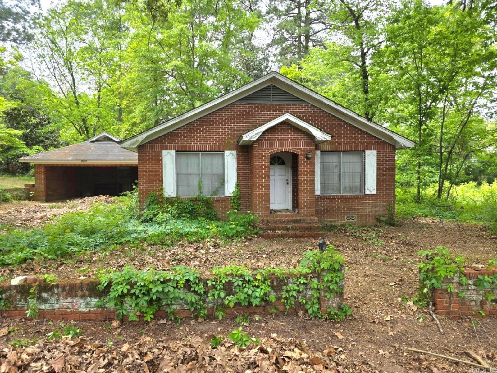 Welcome to your new home! This home needs a little TLC, located just outside of downtown Chidester. It's all Brick and has the Original hardwoods in the main living areas and bedrooms, and easy care vinyl in the kitchen. This is an Estate and is selling "As-Is". So much potential here. All that's needed are your personal updates. Awesome fixer upper! Hurry to see it!