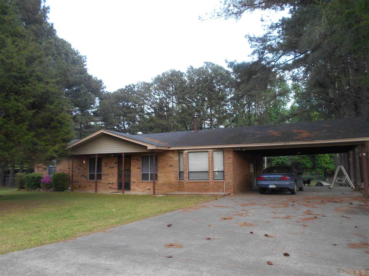 Great family home one one acre. Large back yard fenced. Storage/shop Wired for travel trailer hookup.Home offers separate dining room and living area. Extra insulation, ceiling fans allows home to be well heated by wood burning stove. Good floor plan with a lot of possibilities. Storage in home. Large two car carport. Wonderful yard goes beyond the fenced areas. Wooded area behind fence offers privacy. Fertile garden area. Jvill school bus to door, or Lonoke s bus at south end of Lowery
