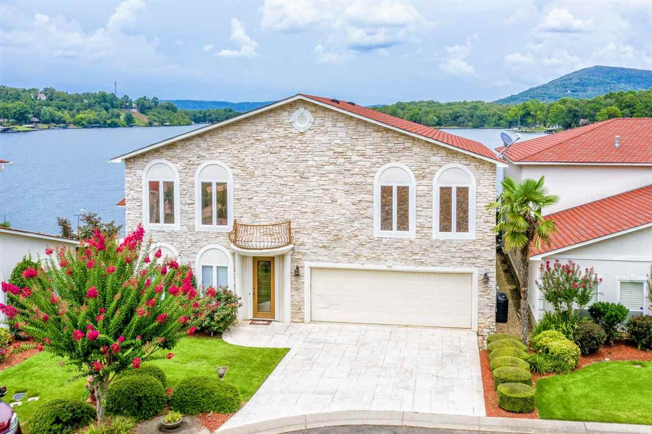 Panoramic views!! From this Beautiful Mediterranean Style home sitting on waters edge in this premier gated community. Spacious High-End Luxury home consist of 5br/4Ba, Lg. Master Suite w/walk-in shower and Jacuzzi on main level, 2-fireplaces, 2-living areas plus wet bar, 2- patios, unbelievable views from outdoor kitchen which includes deep fryer, grill, microwave, ice maker and frig. Plus, 2-car garage and Covered boat slip and Seadoo dock.