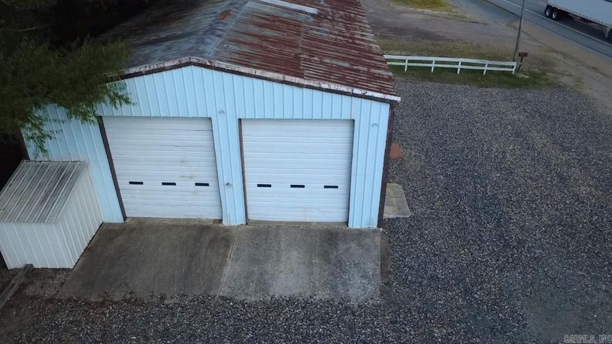 This is nice vacant metal building with an office, bathroom and waiting area and then there is a big shop with tall doors to the back. This could be a great location and building for several different kinds of businesses!