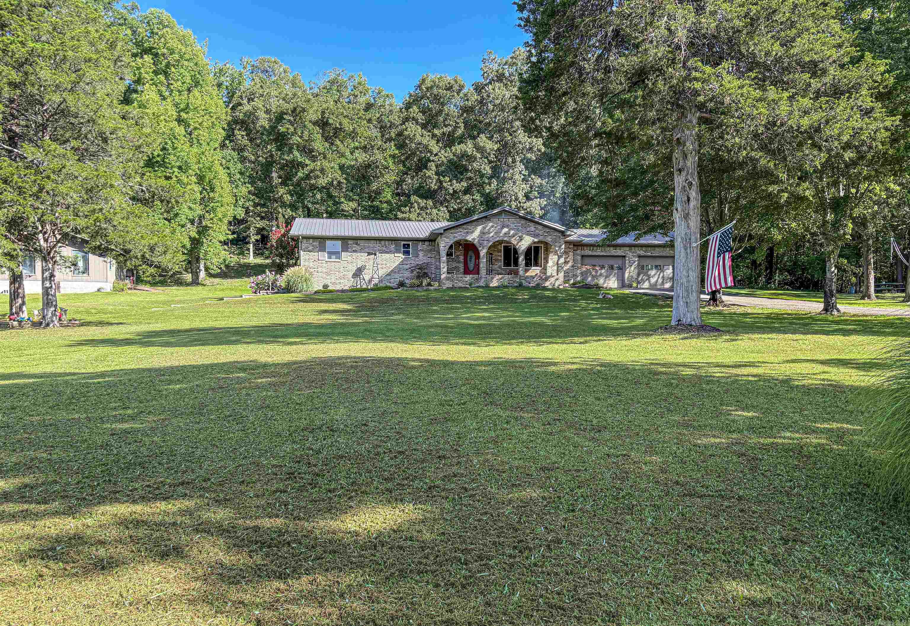 Charming 4 bed, 3 ba home 2.35 park-like acres, tucked away at the end of a paved road - just outside of one of Arkansasās most scenic towns! Conveniently located just a short 3-minute drive from Downton Jasper, local restaurants and shopping, for the perfect blend of seclusion and convenience. Enjoy the stunning views of the iconic Round Top Mountain from your front porch. Step inside to find a warm and inviting layout with an open floor plan concept living and dining room, plenty of room for the whole family and entertaining, a beautiful kitchen with luxury appliances, generously sized bedrooms, ample storage space. The basement features a large built-in gun safe, an additional garage, and extra living or office space. With no restrictions, you can truly make this place your own. Bring your horses and chickens and build your dream homestead! Call now to schedule your private showing, because this property checks all of the boxes.