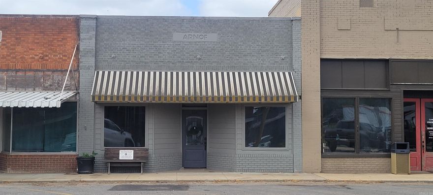 Renovated commercial building in downtown McCrory has previously served as the location of a successful art studio business, a specialty drink shop, and a clothing boutique. Although there is no kitchen, this space does have a half bath and separate shower and was most recently utilized as a residential property. There is a private room in the back that would be ideal for an office if the building was purchased for a commercial business or could possibly be used as a small bedroom area if converted for residential purposes.