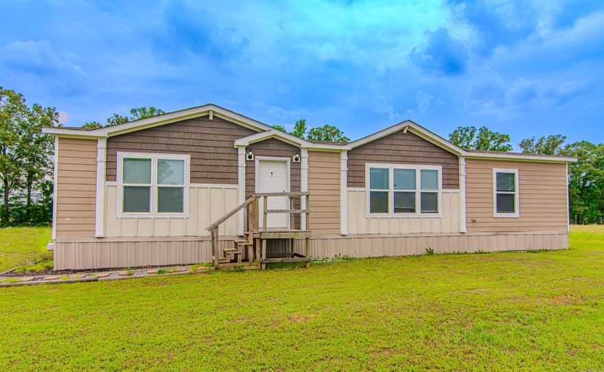 Welcome to your new home! This property offers a unique opportunity to own a nearly new home with plenty of space both inside and out. This charming 2018 mobile home, set on a permanent foundation, sits on just under an acre in the peaceful community of Ward. This home offers up a perfect blend of modern convenience and serene country living. With 3 bedrooms and 2 bathrooms, this home provides ample space for families or individuals looking for extra room. Built in 2018, the home includes contemporary finishes and fixtures, ensuring a move-in ready experience. Enjoy outdoor activities or create your dream garden on this expansive lot, providing nearly an acre of space. Located in the heart of Ward, you'll have easy access to local amenities, schools, and major roadways while still enjoying the tranquility of a rural setting. Schedule your showing today and experience the perfect blend of comfort and convenience. AGENTS SEE REMARKS.