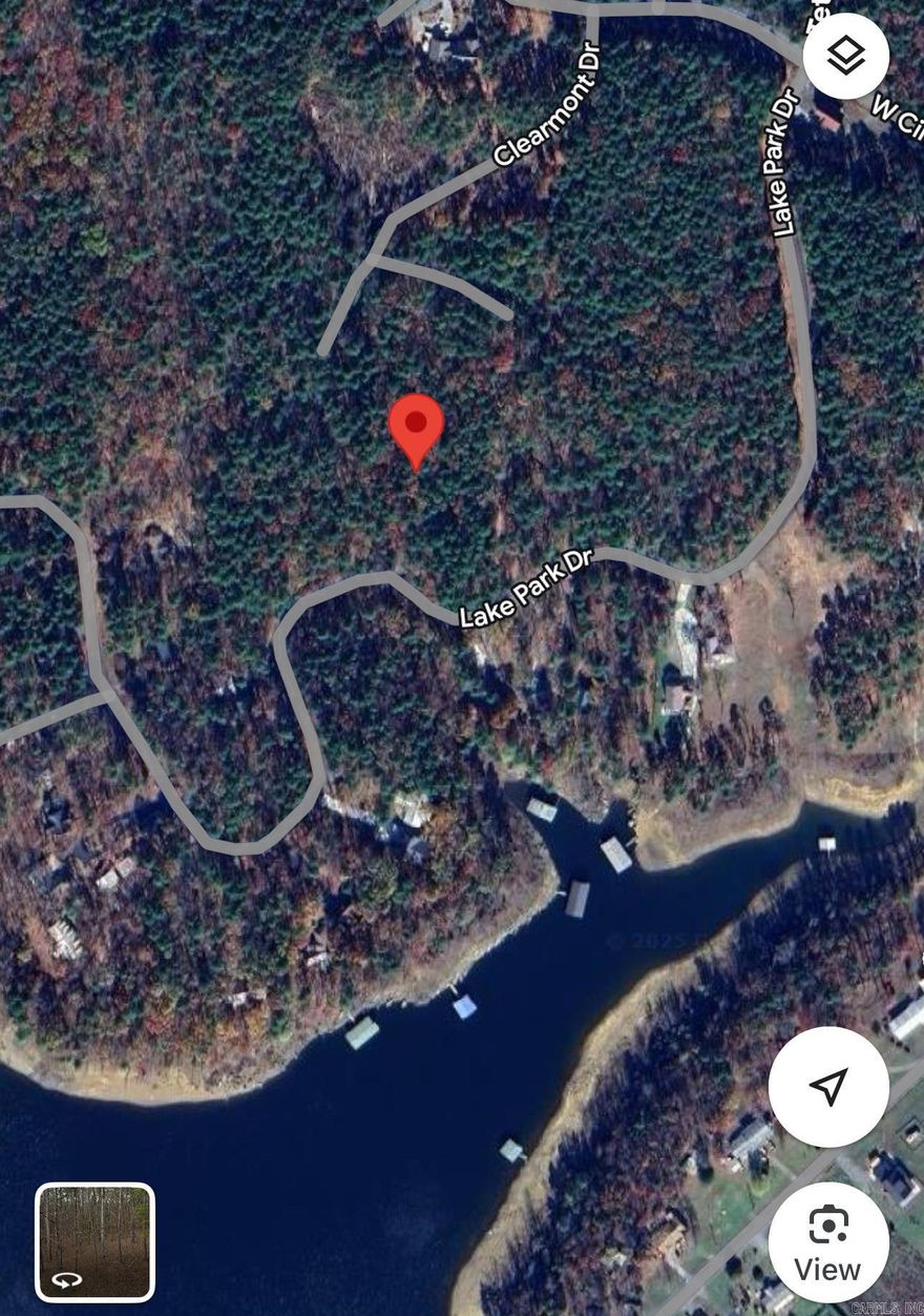Wooded Lot less than a 1/2 mile to Circle Acres concrete Boat ramp with parking spaces at ramp for boat and trailers. ALSO,90+ miles of ATV trails up the road. Minimum of 1,200 sq.ft. to build. No mobiles allowed.The Cabins & Lakehouses in the area provide that lake feel people are looking for.Majority of the homes are weekenders in the area & a few full time as well.Only 7.6 miles to the town of Greers Ferry, only 3.4 miles to Indian Hills Golf Course, & FFB also has miles of Mountain Bike Trails .