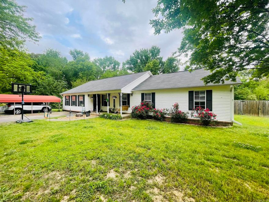 Charming 4-Bedroom Home in the Heart of Searcy! This beautifully designed home offers 4 spacious bedrooms and 3 full bathrooms, including two master suites thoughtfully positioned on opposite ends for maximum privacy and convenience. On one end, you'll find a cozy master bedroom with a full bath, alongside two generously sized bedrooms. On the other, a newly renovated primary suite with a full bath, perfectly situated next to the laundry room for added ease. The kitchen and dining area provide ample cabinet space, making storage a breeze. Step outside onto the 10x18 covered deck, ideal for relaxing and entertaining, while the newly fenced-in backyard offers both privacy and security. Two covered parking areas with a convenient circle driveway. Recently added gutters for improved maintenance. A durable roof (9-10 years old) and an updated HVAC system (5 years old) for lasting peace of mind. Nestled in a desirable location, this home perfectly blends comfort, functionality, and charm—ready to welcome its next owner. Don't miss out—schedule your showing today