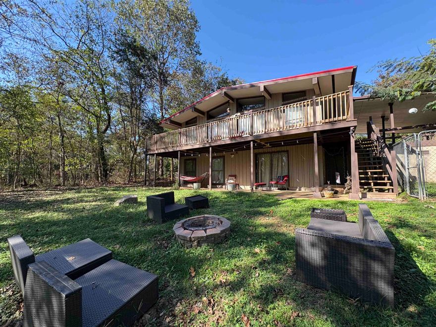 Discover your Ozark escape—where investment meets lifestyle. This 3-bed, 2-bath, 2,048 sqft Holiday-style home sits on a dead-end street just a short walk to the South Fork River. Every inch has been thoughtfully upgraded: stainless appliances, whole-house water filtration, new flooring, brand-new deck, and a fully remodeled walk-out basement transformed into a private suite. Downstairs features a spacious bedroom, living area, spa-inspired bath with walk-in shower + soaking tub, and laundry. Upstairs on the main floor, the open-flow kitchen and living room with vaulted ceilings & big bay windows keep the signature Holiday charm alive, with 2 bedrooms and a full bath down the hall. Step outside to relax on the deck or around the backyard fire pit surrounded by trees. Sold fully furnished—everything stays, from décor to washer and dryer—this turnkey Airbnb is ready to keep generating income or become your personal retreat. Enjoy access to seven lakes, two rivers, and the nearby North Golf Course—welcome to your next investment in the Ozarks!