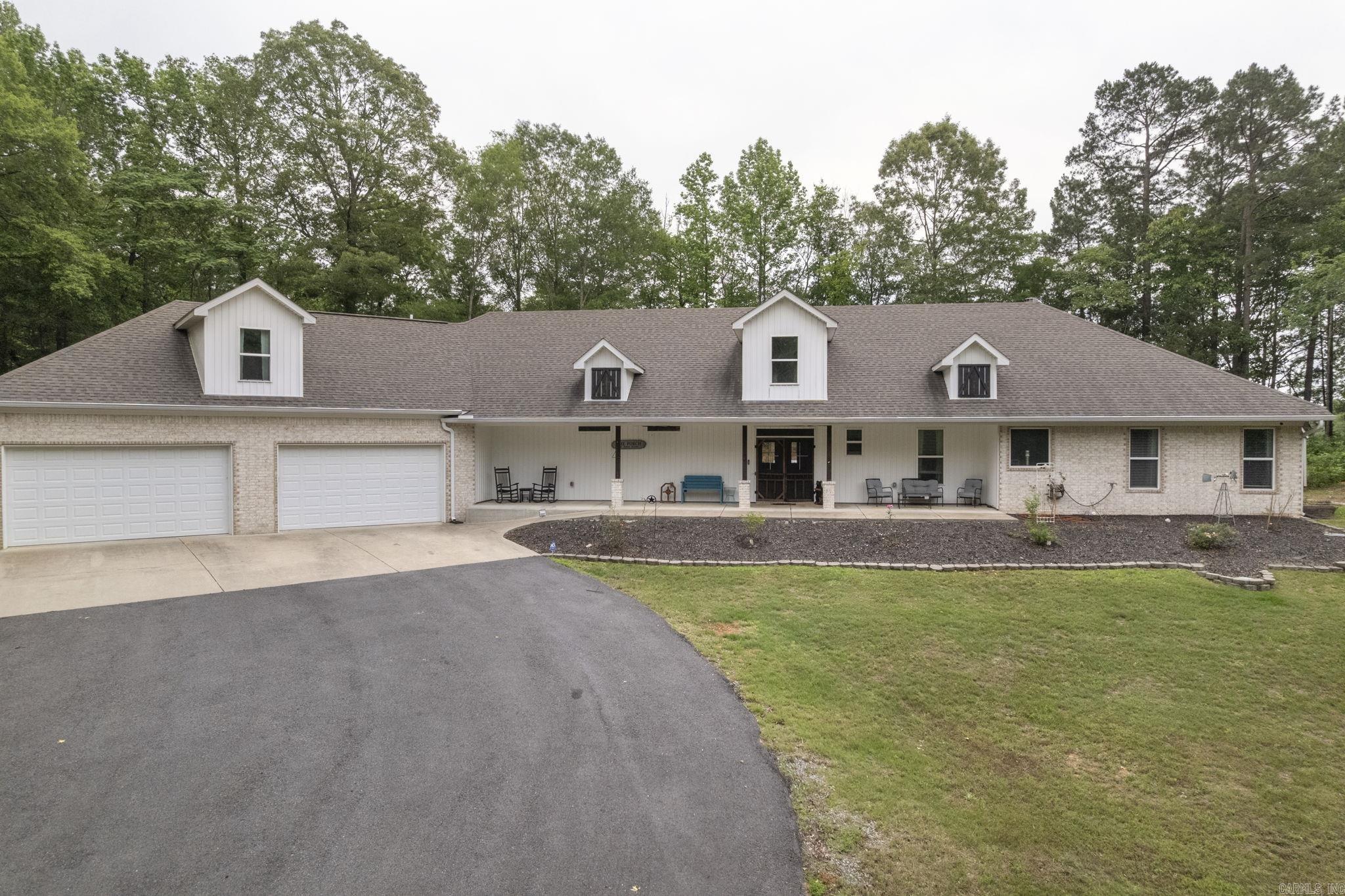 Swimming Pool! 30x30 Shop! 3,831sqft! 2.36 acres! Safe Room! From the second you walk in the home you will see custom touches all throughout! From vaulted ceilings with wood beams, custom cabinetry, barndoor style window shutters, custom butcher block countertop, there's even a rustic metal ceiling in the kitchen! The open concept design offers the perfect space for guests and entertaining! The gourmet chef's kitchen offers a gas stove for all the true chef's and a pantry for plenty of storage. The primary bedroom has an ensuite bathroom with walk-in closets, clawfoot style tub and a frameless glass walk-in shower! The guest rooms at the other side of the home offer privacy and separation when needed! The large bonus room is upstairs through the oversized garage and would make an excellent bedroom or theater room! You will enjoy making memories in the pool while grilling out under the gazebo! The 30x30ft custom shop with electric offers room for all your toys as well! Other features include leaf guard gutters, tankless HW tank, Frigidaire Commercial SS appliances and a safe/tornado room! Seller will pay to add closet to bonus converting into a 4th bedroom.